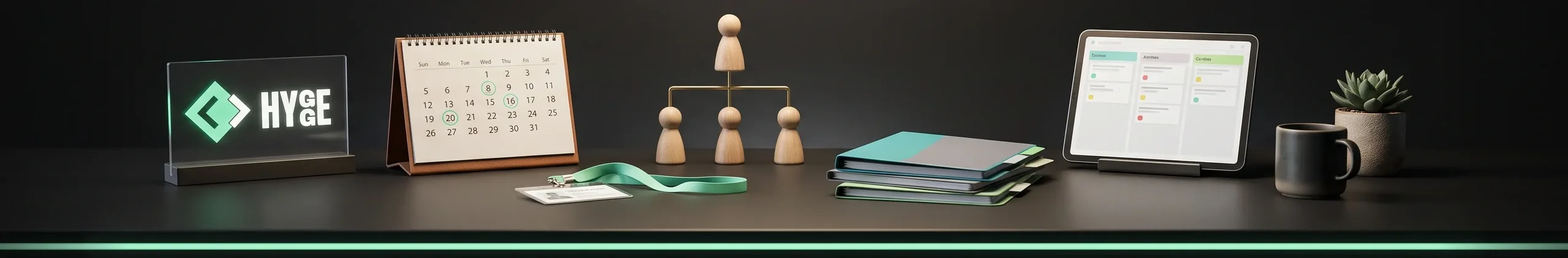 Dark desk with a glowing Hygge sign, a desk calendar with circled dates, an ID badge on a mint lanyard, a wooden org chart of peg figures, folders and a tablet with a task board